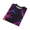 A t-shirt featuring a stylized illustration of a gorilla's face with vibrant neon colors, including pink, blue, and purple, against a dark background with abstract streaks and speckles.