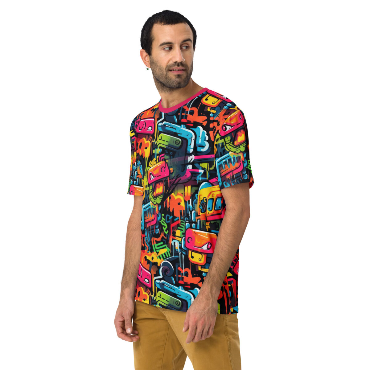 Vibrant pink, orange, yellow, blue graffiti shapes, cartoonish robot faces cover this patterned tee shirt.