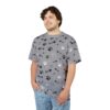 Black and white paw prints and fish skeletons cover this oversized full print tee, scattered across a grey background.