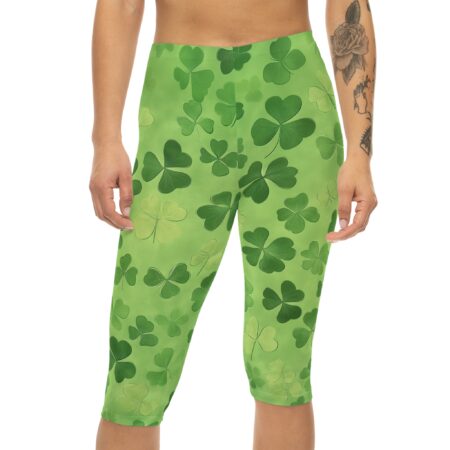 Green clover all over print capri leggings featuring a seamless shamrock pattern.