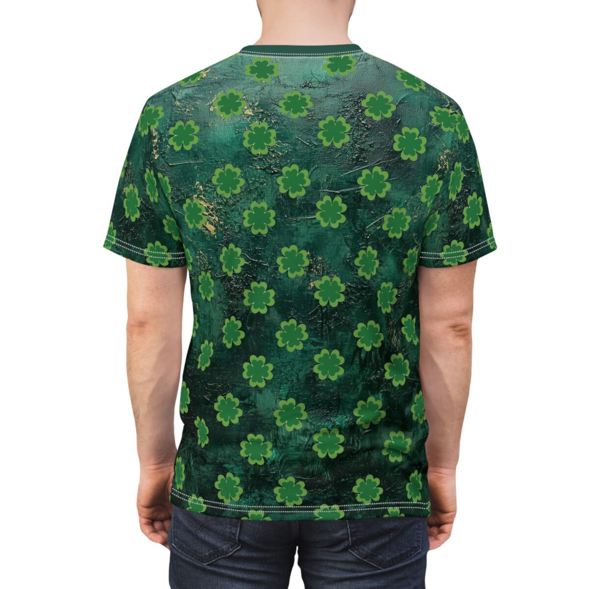 All over print t-shirt featuring a repeating pattern of green shamrocks on a dark green textured background.