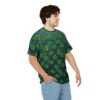 Green t-shirt featuring a repeating shamrock pattern with a textured grunge background.