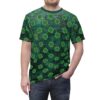A dark green t-shirt is adorned with a repeating pattern of bright green shamrocks. The fabric has a textured appearance with subtle gold accents.