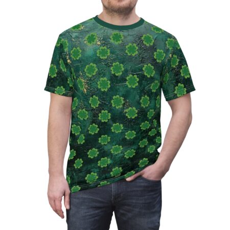 A dark green t-shirt is adorned with a repeating pattern of bright green shamrocks. The fabric has a textured appearance with subtle gold accents.