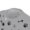 Black paw prints and fish skeletons cover this seamless pattern tee, with some faint paw prints in a lighter grey.