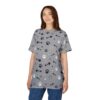 This grey t-shirt is covered in a repeating pattern of black and white paw prints and fish bones.