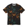 Spooky carved pumpkins and falling leaves cover this dark tee shirt, with eerie trees and glowing lanterns in the background.