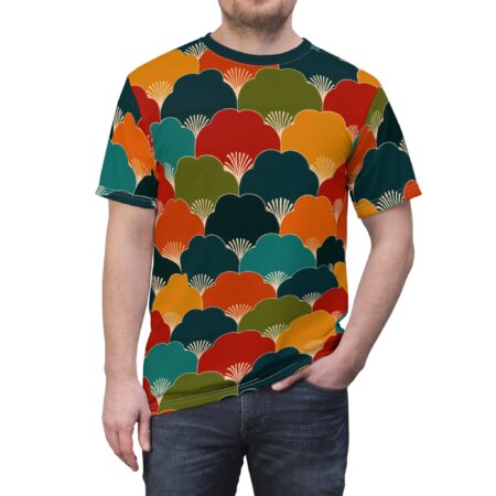 Red, orange, yellow, teal, and dark green cloud-like shapes with white fan details cover this oversized full print tee, creating a bold, graphic pattern.
