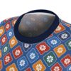 Blue all over print sublimation tee with seamless wrap around graphic of vintage Japanese floral pattern in red, orange, green, and blue.