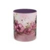 Ceramic coffee mug with a floral and watercolor design, featuring text 'Just a Mom Who Loves Dogs'.