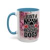 White mug with blue handle and interior, featuring pink flowers and the text "Just A Mom Who Rescues Dogs" with a paw print and hearts.