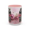 Pink floral coffee mug with text 'Just A Mom Who Rescues Dogs' and paw print graphic.