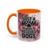 White ceramic mug with orange handle and interior, featuring 'Just A Mom Who Rescues Dogs' text with paw print and hearts, surrounded by floral watercolor design.