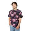 Pink and black cartoon bats with tiny pink hearts cover this patterned tee shirt, set against a dark purple background.