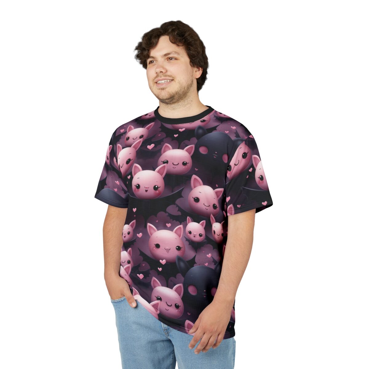 Pink and black cartoon bats with tiny pink hearts cover this patterned tee shirt, set against a dark purple background.
