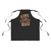 Black apron with 'King of the BBQ' text and a graphic of ribs on a grill.