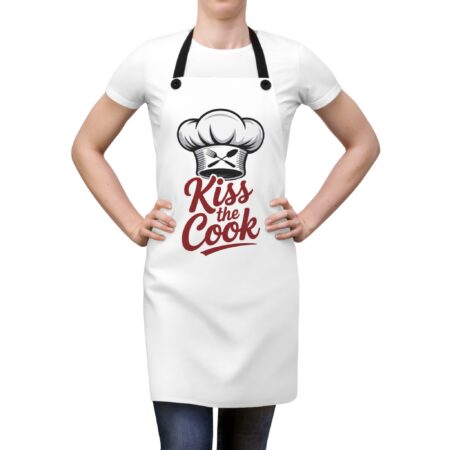 White apron with a chef hat graphic and 'Kiss the Cook' text, perfect for kitchen use and gifts.