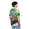 Green palm fronds and a fluffy koala playing a ukulele cover this 3D graphic t-shirt, set against a lush jungle background.