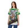 Sublimation tee, all over print, koala playing ukulele, green tropical leaf background, wrap around graphic.