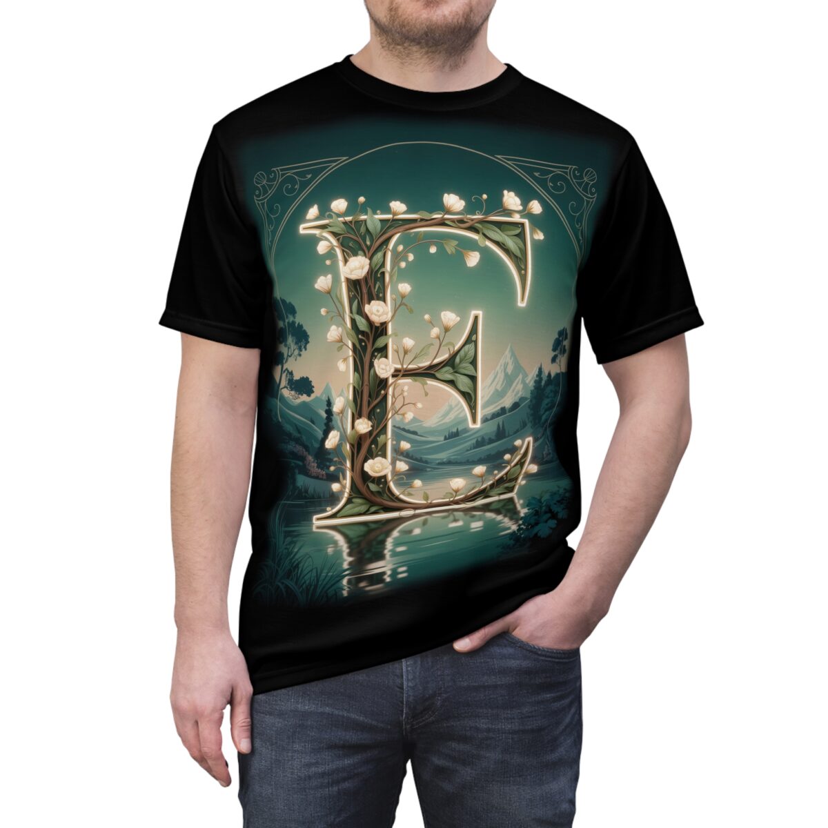 Green and white flowers and leaves cover this all over print apparel, depicting a luminous letter E set against a serene mountain landscape and lake.