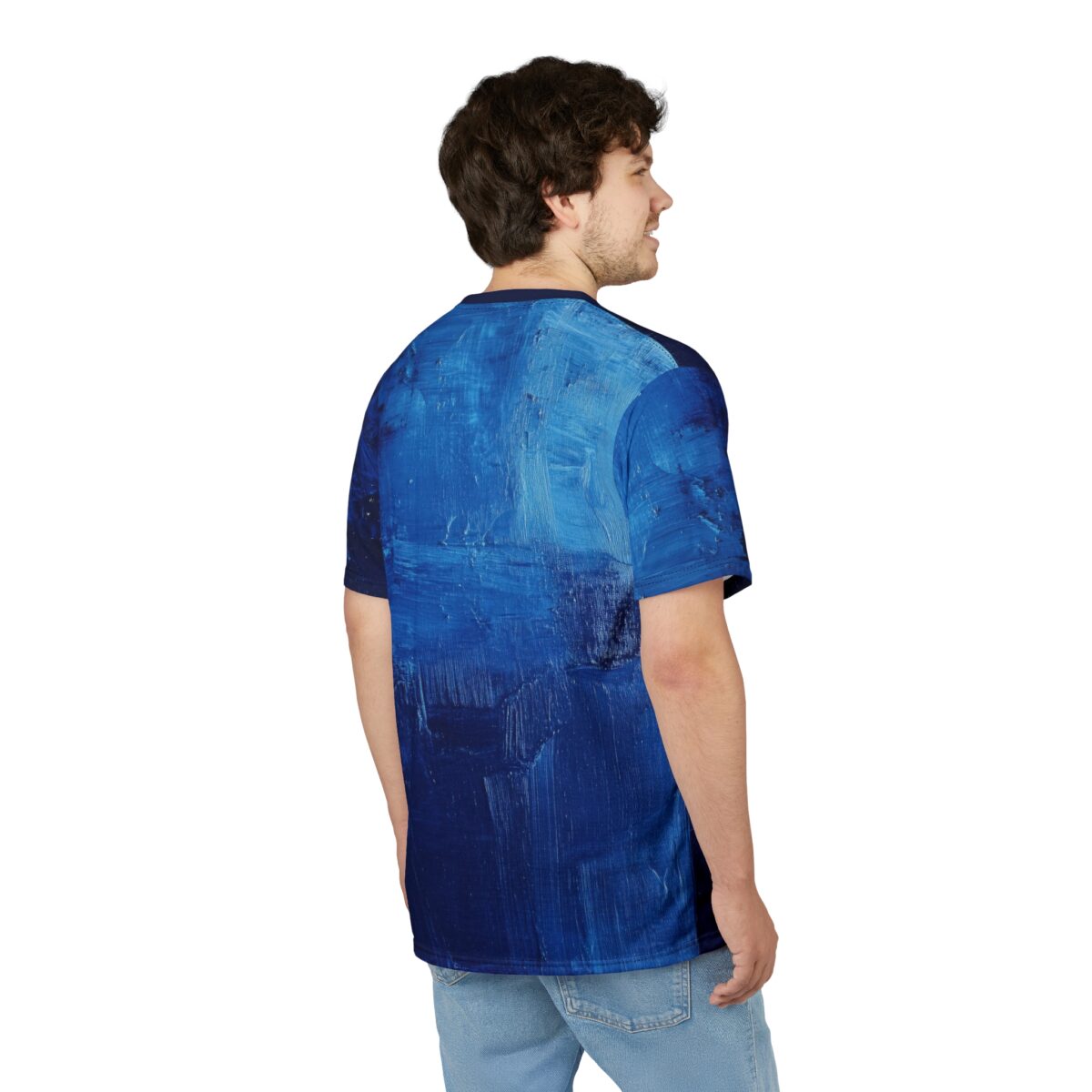 Back view of a man in a blue short-sleeve t-shirt with an abstract painted texture.