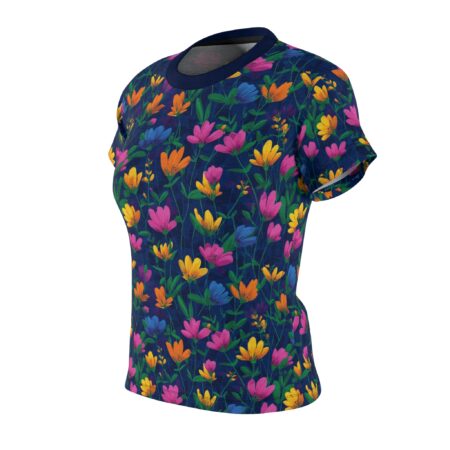 Navy blue sublimation tee with a colorful all over print featuring pink, yellow, and blue flowers with green foliage.