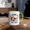 White ceramic mug with a green handle, featuring a cute sloth in a hammock with the text "NOPE NOT TODAY".
