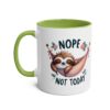 A white ceramic mug with a green handle and interior, featuring a cute sloth sleeping in a hammock with the words "Nope Not Today".