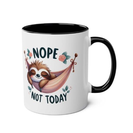 White ceramic mug with a black interior and handle. Features a cute sloth in a pink hammock with "NOPE NOT TODAY" text.