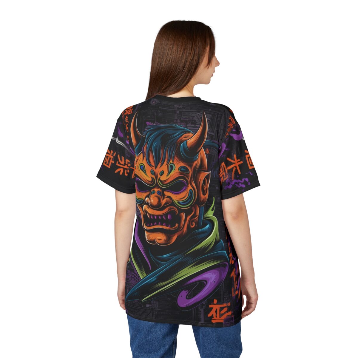 A person wearing a black t-shirt with a colorful Oni mask graphic on the back.