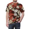 Creamy white flowers with red centers, green leaves, and red berries cover this all over print apparel, set against a reddish-brown background.