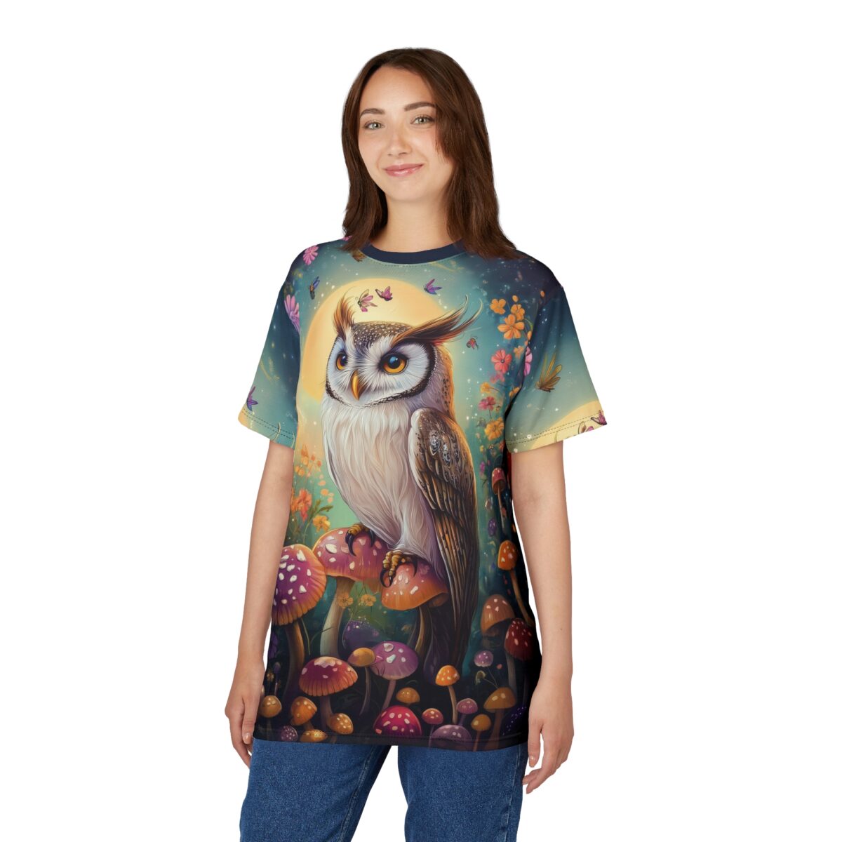 Vibrant mushrooms, colorful flowers, and fluttering butterflies cover this oversized full print tee, featuring a majestic owl against a glowing moon.