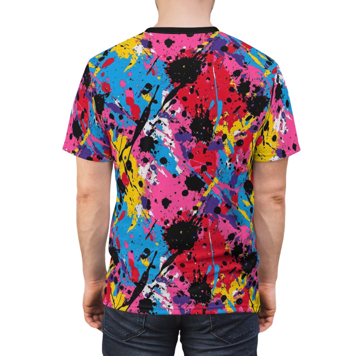 Bright pink, electric blue, bold yellow, and deep purple paint splatters cover this 3D graphic t-shirt, with black and white accents creating a dynamic abstract design.