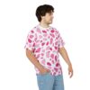White with pink abstract blotches cover this sublimation graphic tee, no background elements are present.