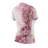 Pink watercolor floral wrap around graphic sublimation tee featuring gold accents and a seamless print design.