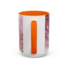 White ceramic coffee mug with vibrant pink floral design and "Best Aunt Ever" text. Features an orange interior and handle.