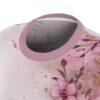 Soft pink floral watercolor sublimation tee featuring delicate flowers and gold accents with a seamless all over print design.