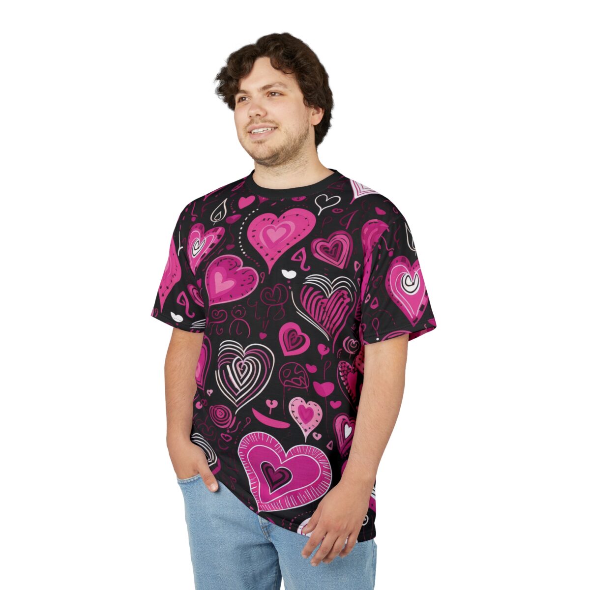 Pink and white hearts of various sizes and styles cover this black t-shirt, with dotted lines and swirls in the background.