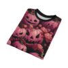 Pink pumpkins with carved faces and roses cover this 3D graphic t-shirt, with dark leaves and vines in the background.