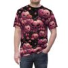 Pink pumpkins with carved faces and pink roses cover this graphic streetwear tee, with a dark, moody background.