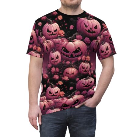 Pink pumpkins with carved faces and pink roses cover this graphic streetwear tee, with a dark, moody background.