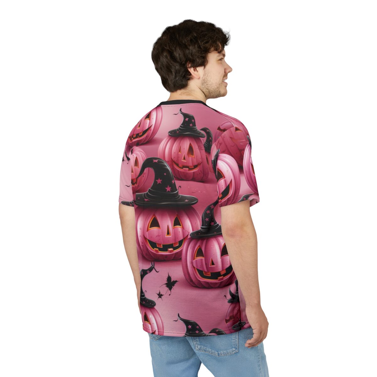 Pink pumpkins with black witch hats and stars cover this all over print apparel, with scattered black leaves.