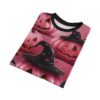 Pink pumpkins with carved faces and black witch hats decorated with pink stars cover this patterned tee shirt, with a spooky Halloween theme.