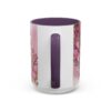 White ceramic coffee mug with purple interior and handle, featuring a pink watercolor floral design with gold accents.
