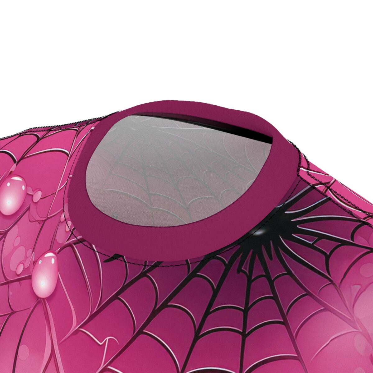 Pink spiderwebs and dew drops cover this graphic streetwear tee, with a black and white web pattern.