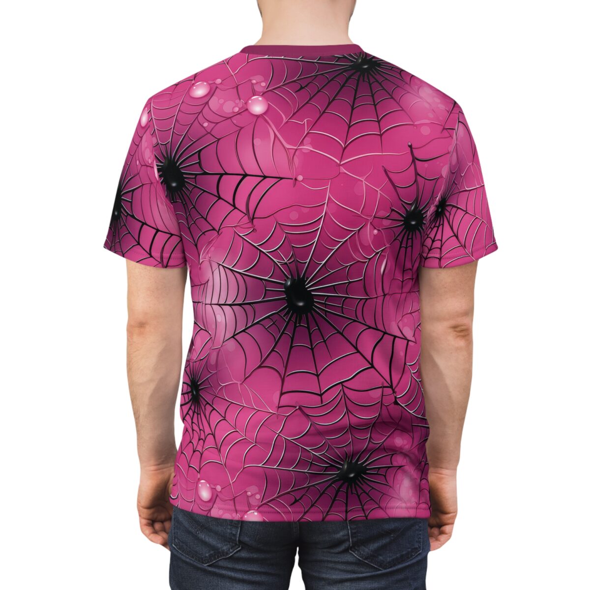 Pink spiderwebs with black spiders and dew drops cover this all over print apparel, the design features radiating web patterns.