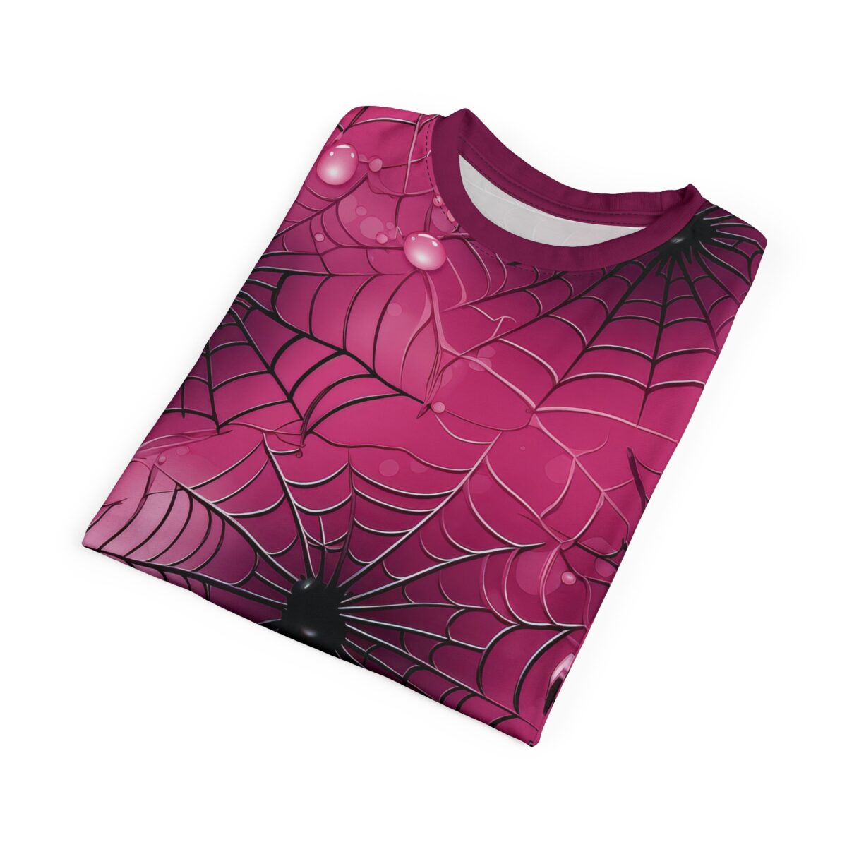 Deep pink spiderwebs with glossy dew drops and black spiders cover this sublimation graphic tee.