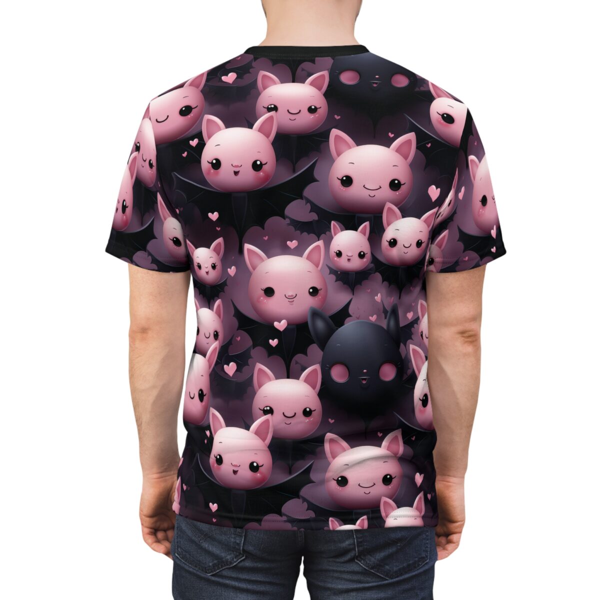 Pink and black bat shapes, hearts, and cute bat faces cover this graphic streetwear tee, with a dark, moody background.