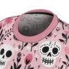 Features a vibrant seamless print of sugar skulls and pink florals with a 360 wrap-around design for unique graphic apparel.