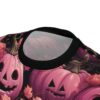 Pink pumpkins and roses cover this 3D graphic t-shirt, with swirling golden vines and dark leaves on a black background.